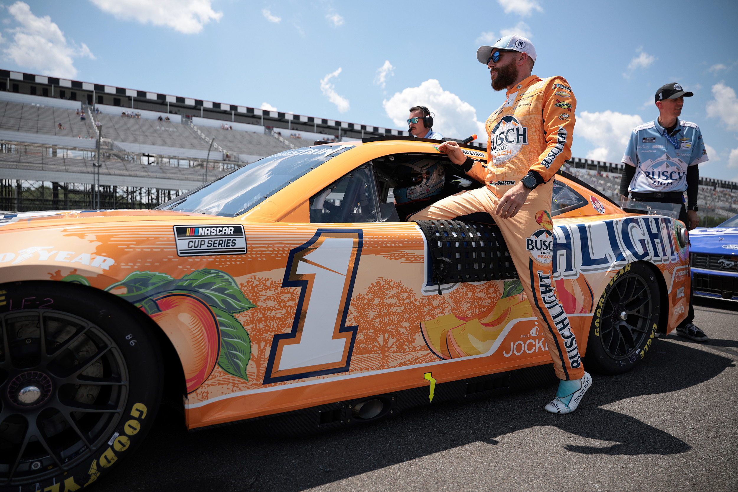 F1 Champion Brand Joins NASCAR As Justin Marks and Pitbull Strike Gold